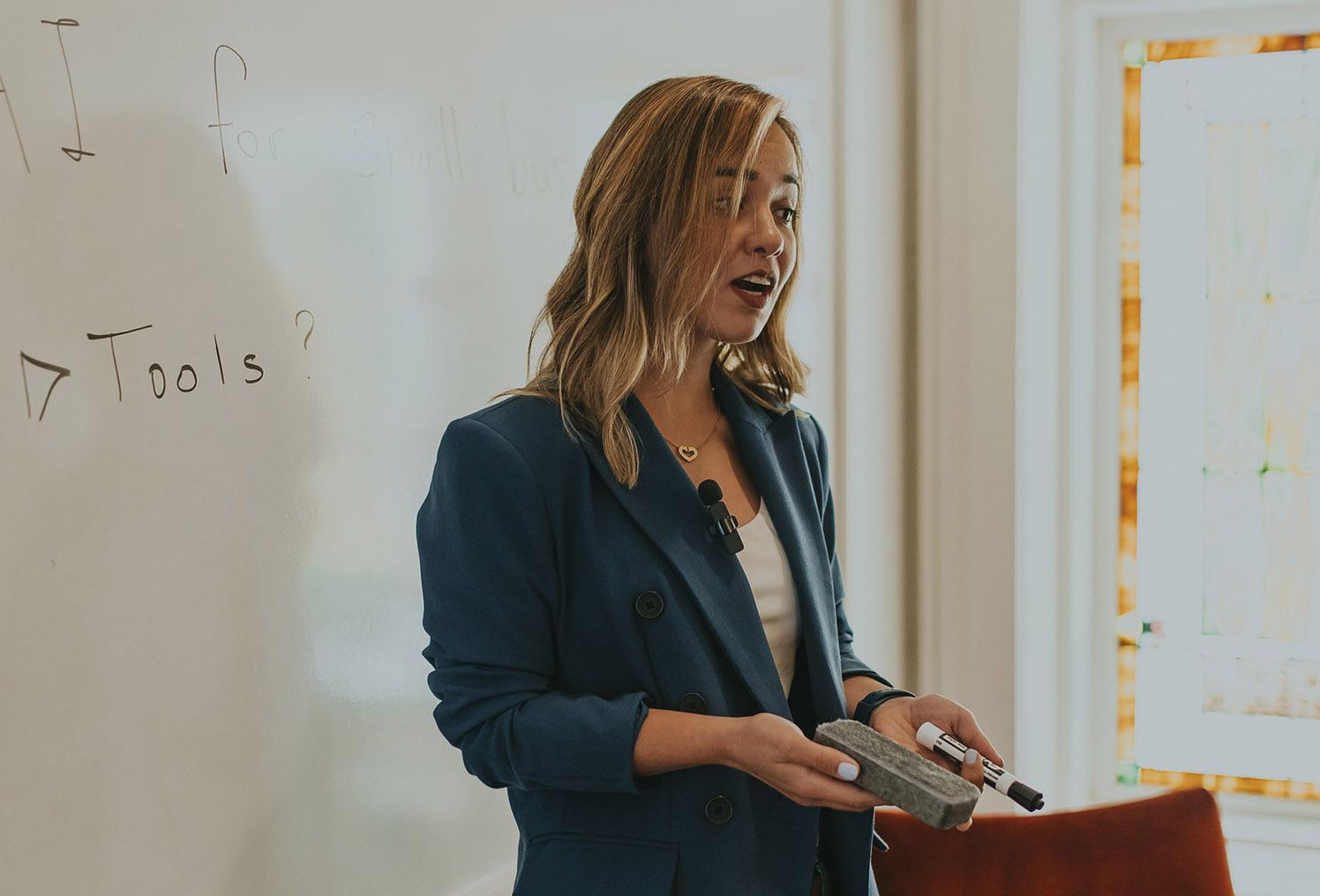 Kam giving a presentation about AI to a group of students